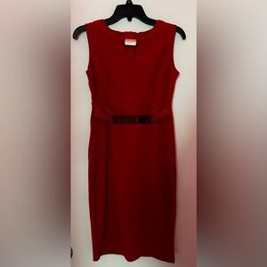 I am selling a size medium red body con dress with gold accents.